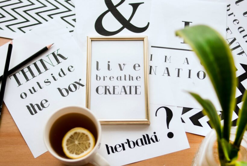 quote calligraphy under cup of lemon tea
